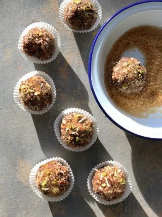 In last weekend’s Globe and Mail, I wrote about sugarplums - confections made of dried fruit and nuts popularized by Clement Clarke Moore’s nineteenth century poem, A Visit from St. Nicholas, can be blitzed up in the food processor in a few minutes, rolled into balls and be ready to go. They’re the ultimate cupboard-cleaner: rummage through your pantry for dried or candied fruit, nuts, seeds, nut or seed butter, cocoa and preserves — anything from honey to marmalade to mincemeat, aiming for a combination of sticky, dry and gooey ingredients that blended together, will create a moist mixture you can squeeze into a ball. 

You really don’t need a recipe for these — no need to measure. 

Sugarplums 

a handful or two of dried fruit, such as dates, figs (stems trimmed), apricots, raisins, cherries
a smaller handful of nuts and/or seeds (salted or not)
a shake of coconut, if you have (and like) it
a big spoonful of peanut or almond butter or tahini 
a drizzle (or another big spoonful) of honey or maple or golden syrup, or sticky sweet preserves such as jam, marmalade or mincemeat
a smaller spoonful of cocoa
a bit of grated orange zest (optional)
1/4 tsp almond or vanilla extract (optional)
a shake of cinnamon (optional)

coarse sugar, shredded coconut or cocoa, for rolling

Combine everything in the bowl of a food processor, chopping any larger dried fruit into smaller pieces, and pulse until well-blended and you have a mixture that is moist and sticky enough that it holds its shape when you squeeze it together, but not so sticky that it makes a mess of your hands. If it’s too sticky, add some dry ingredients, like cocoa, dry oats, cereal or dry cookies. If the mixture is too dry, add something moist, like a drizzle of honey or a bit more nut butter.

Place some coarse sugar or cocoa into a shallow dish. Roll the fruit and nut mixture into about 1-inch balls and roll in sugar or cocoa to coat. Place on a serving plate or in individual paper cups. Store covered at room temperature. Makes as many as you like.